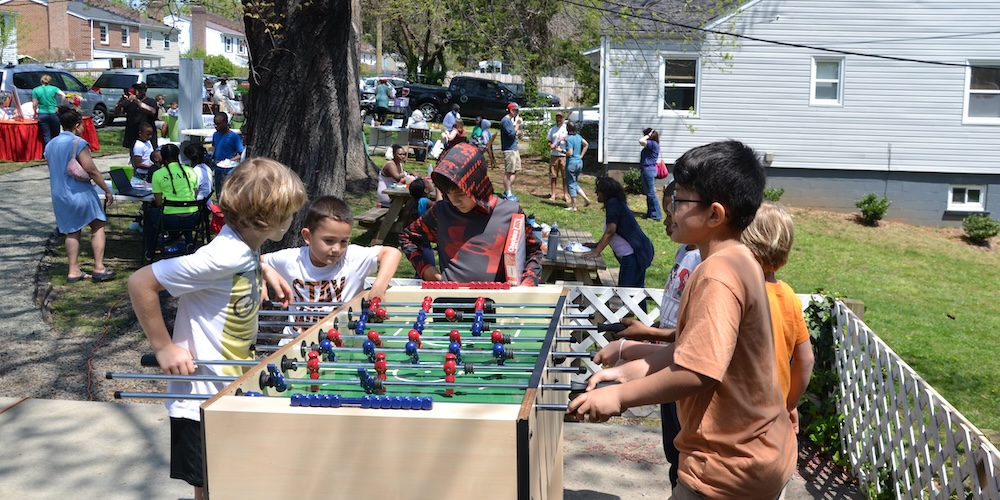 Kids playing foosball at Abundant Life Community Festival